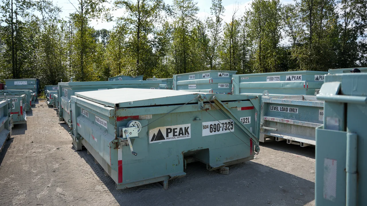 Peak Recycling bin inventory backed by Peak Disposal Services equipment across the Lower Mainland